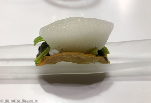 Taco filled with huitlacoche, pumping flower and palo cortado.