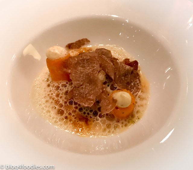 Cod poached in olive oil with braised carrot and chive and coriander sauce